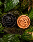 Witoca coffee and cacao soaps on moss among tropical leaves