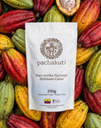 250g bag of Ceremonial Cacao Drops, 100% pure Arriba Nacional, on fresh cacao pods
