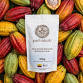250g bag of Ceremonial Cacao Drops, 100% pure Arriba Nacional, on fresh cacao pods