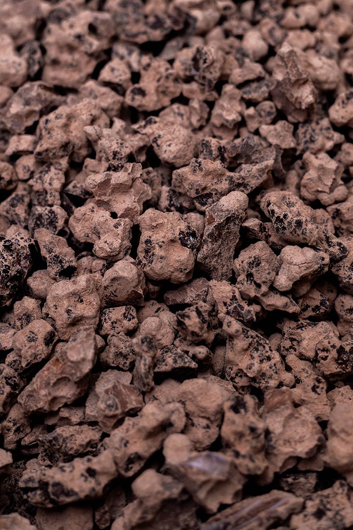 Close-up of hand-cut chunks of Original Cut Ceremonial Cacao