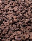 Close-up of hand-cut chunks of Original Cut Ceremonial Cacao