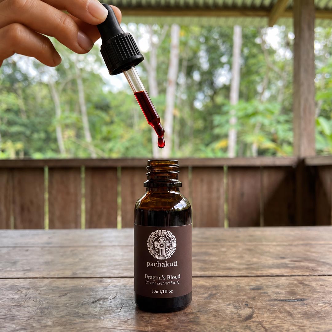 Dropper releasing Dragon's Blood resin into the 30ml bottle