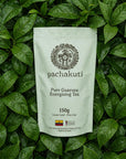150g bag of Pachakuti Guayusa loose leaf tea on fresh guayusa leaves