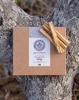 100g box of Pachakuti Palo Santo sticks on a tree branch