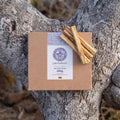 100g box of Pachakuti Palo Santo sticks on a tree branch
