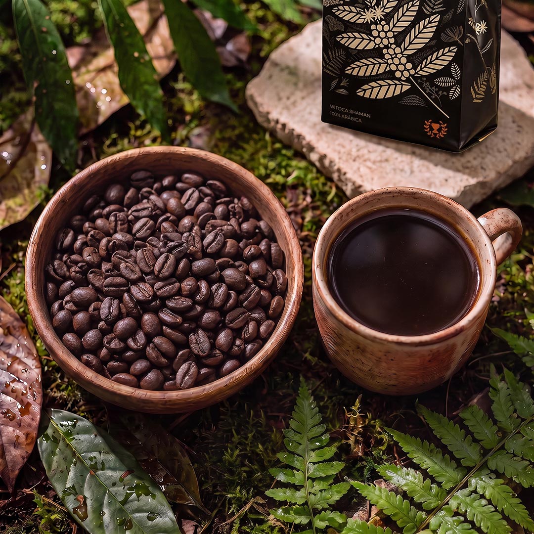 Bowl of roasted Witoca Shaman coffee beans and a cup of black coffee