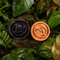 Witoca coffee and cacao soaps on moss among tropical leaves