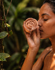 Woman smelling a Witoca handcrafted soap